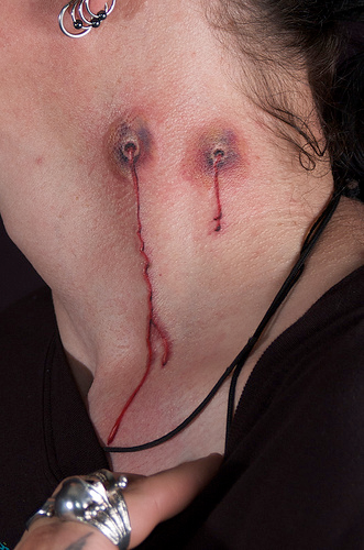 tattoos for girls on neck. vampire bite neck tattoo